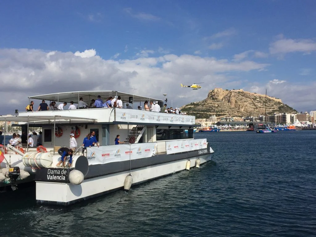 Hospitality boat with guests following a regatta from the front row